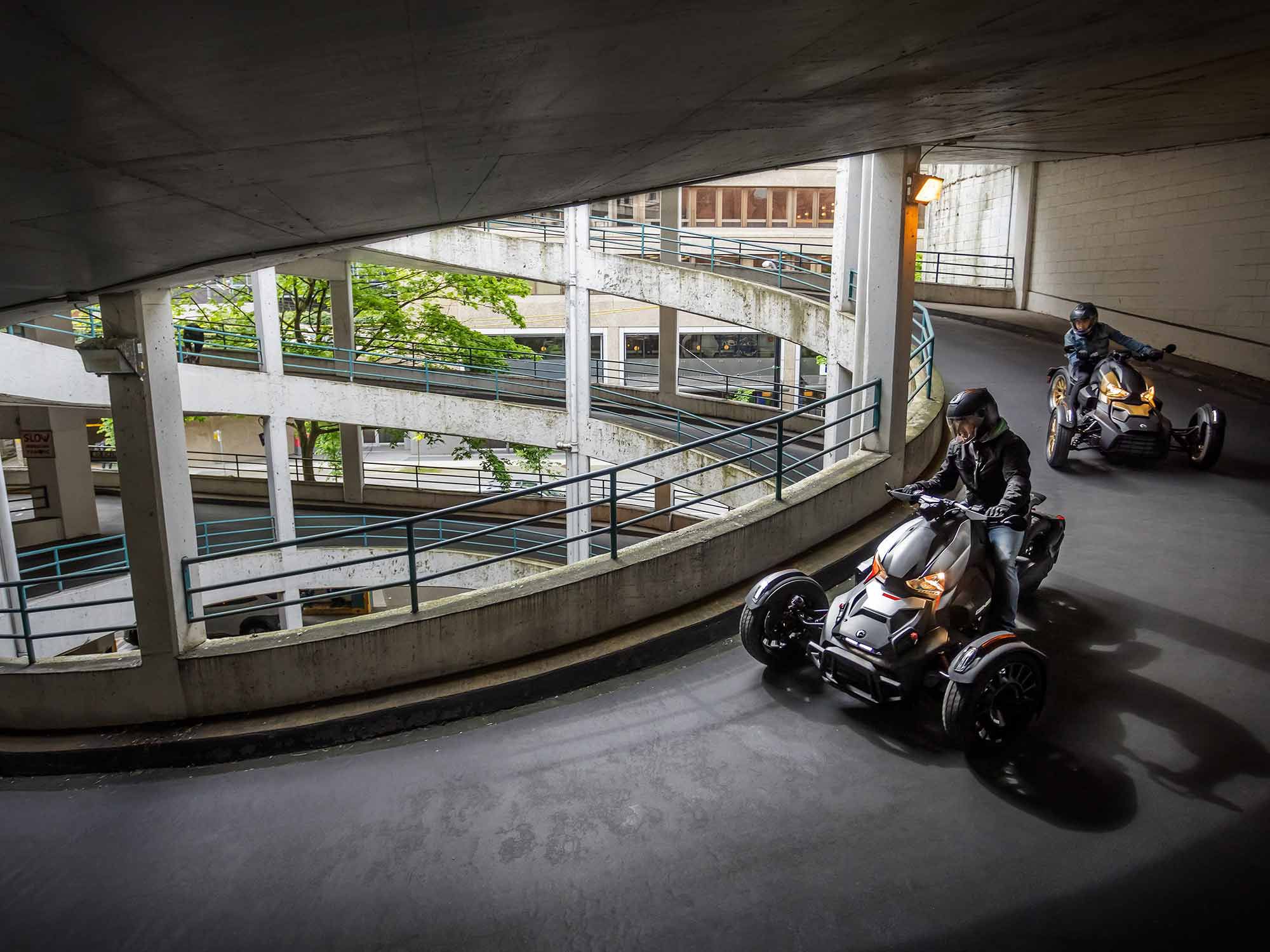 C’mon, that looks fun. Two Can-Am Rykers race to find parking.