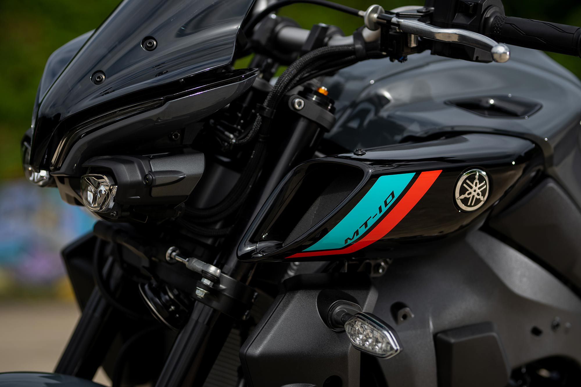 Real ram air scoops feed the 998cc inline four. We love the intake roar of the MT-10 while riding.