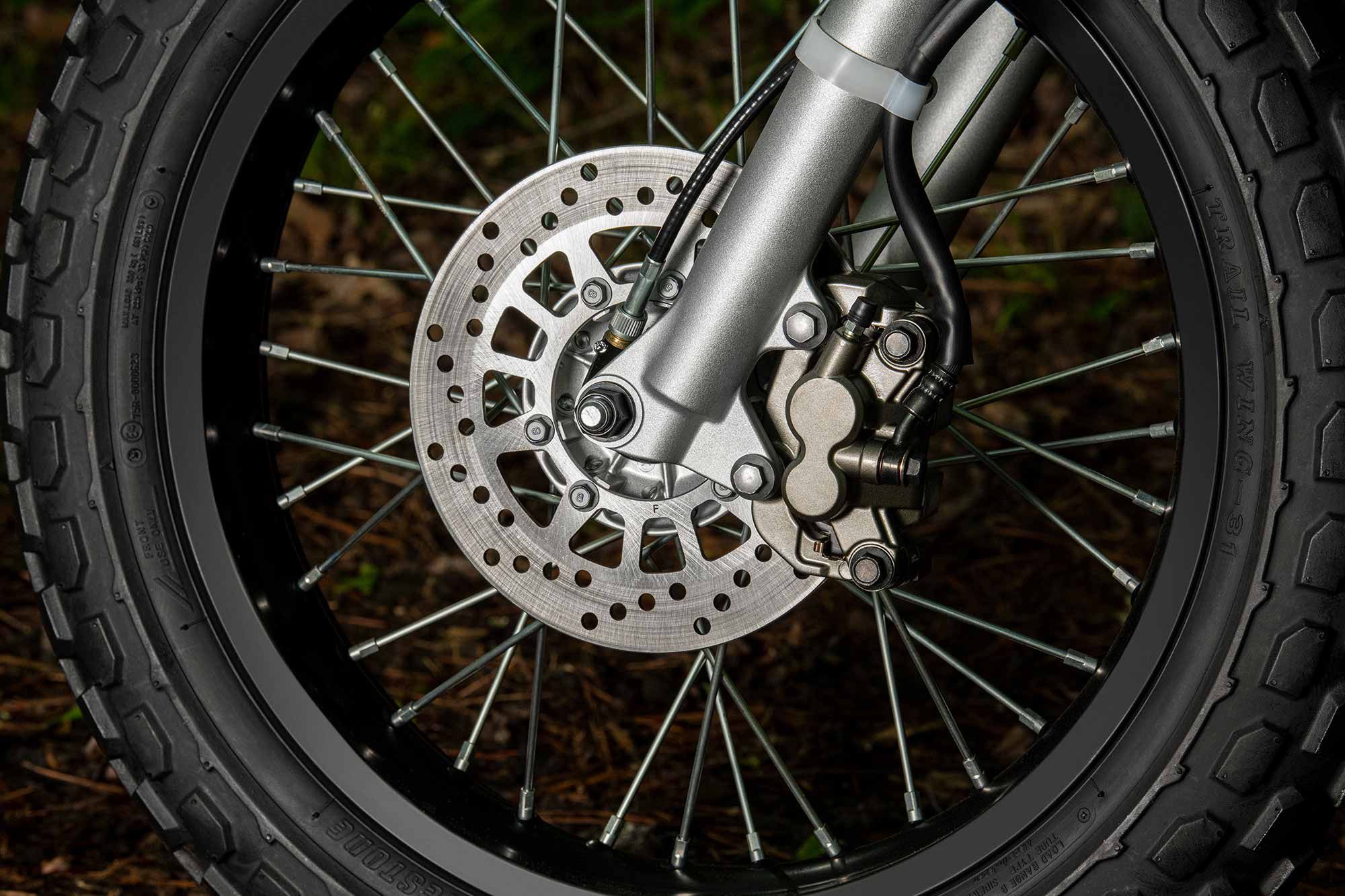 A single 220mm disc and 110mm drum brake help slow the fat-tire dual sport.