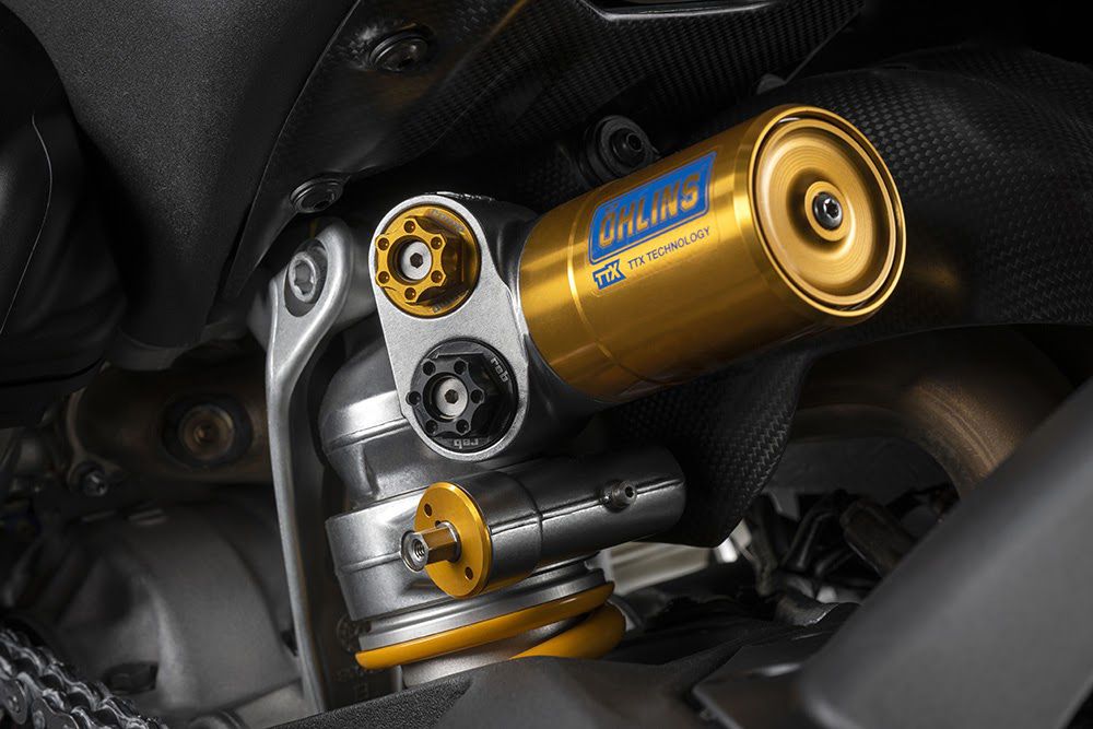 Rear Öhlins shock is less rigid, all the better to conform and maintain grip on uneven surfaces.