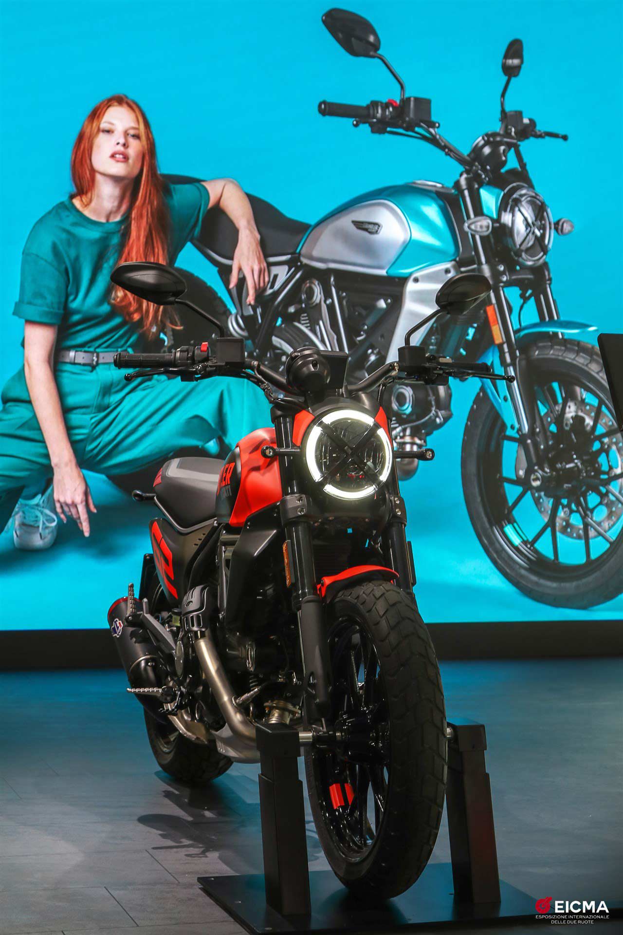The Ducati Full Throttle Scrambler, with aspirational riding companion in background.