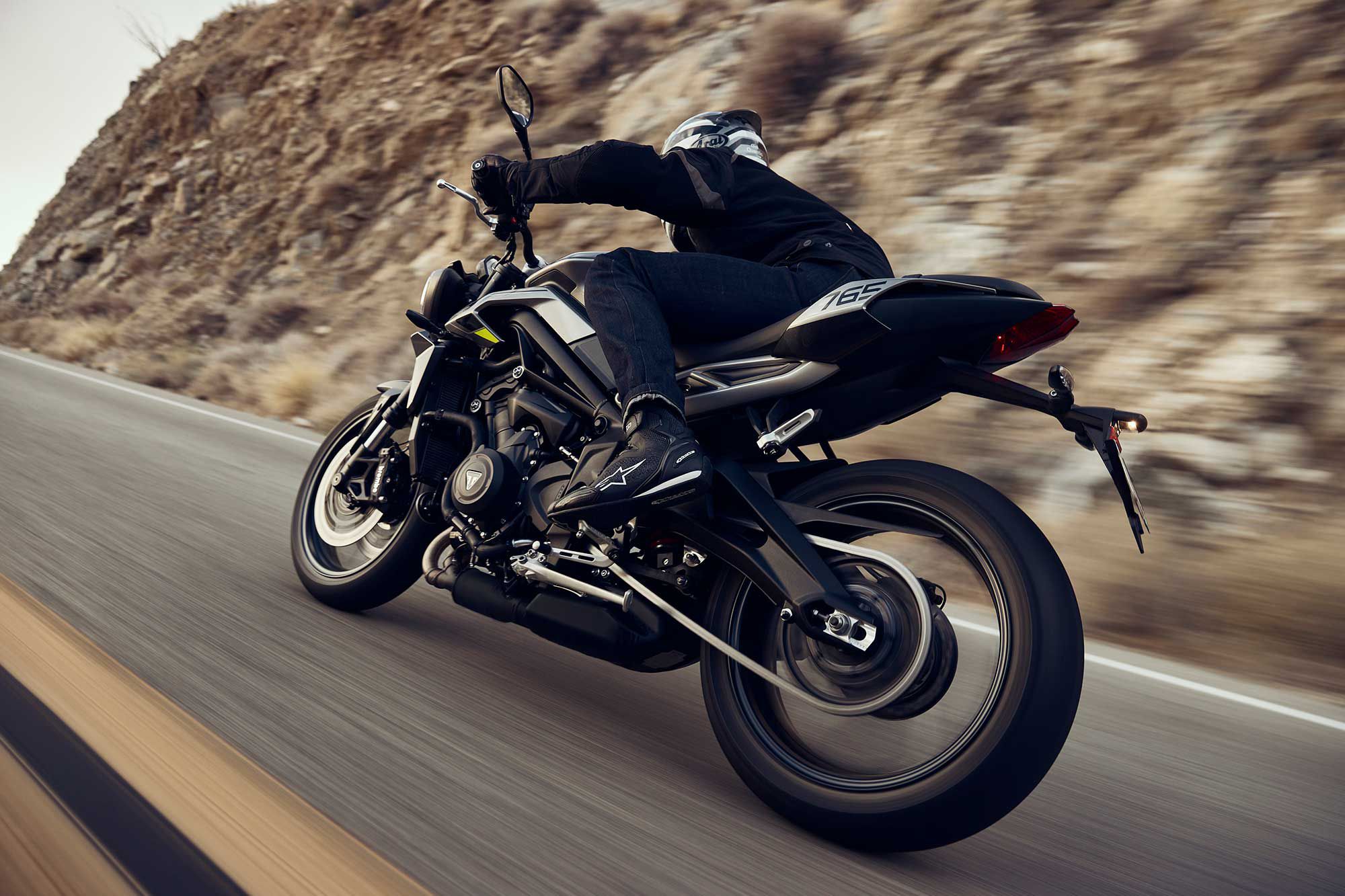 The Triumph Street Triple 765 R, winding through un-wintry roads and locales.