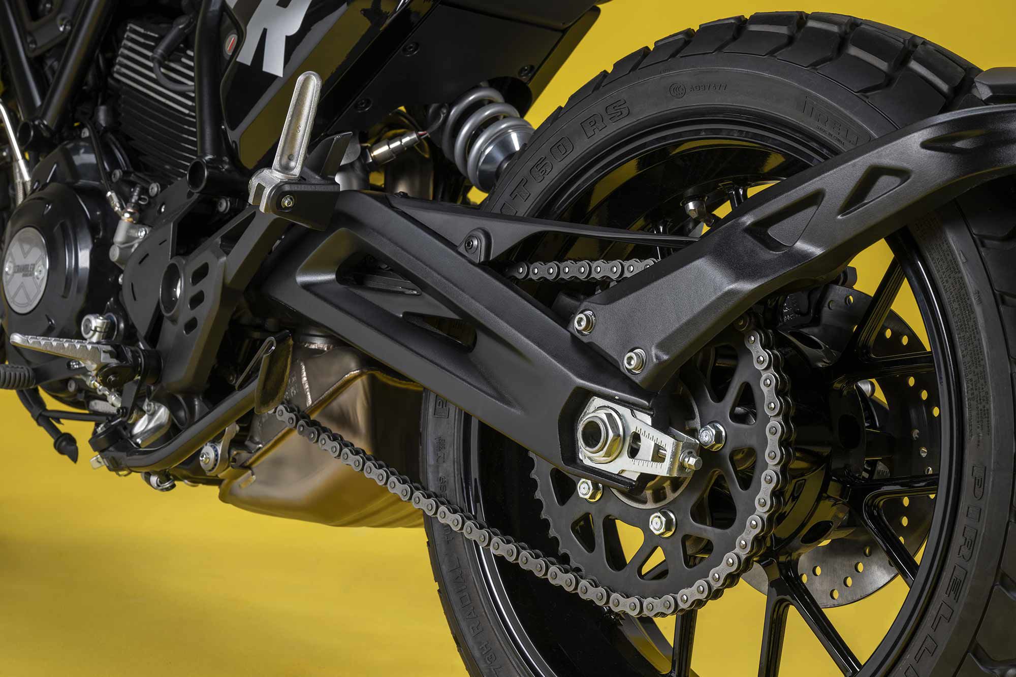 A revised swingarm and trellis frame allowed engineers to centrally position the rear shock.