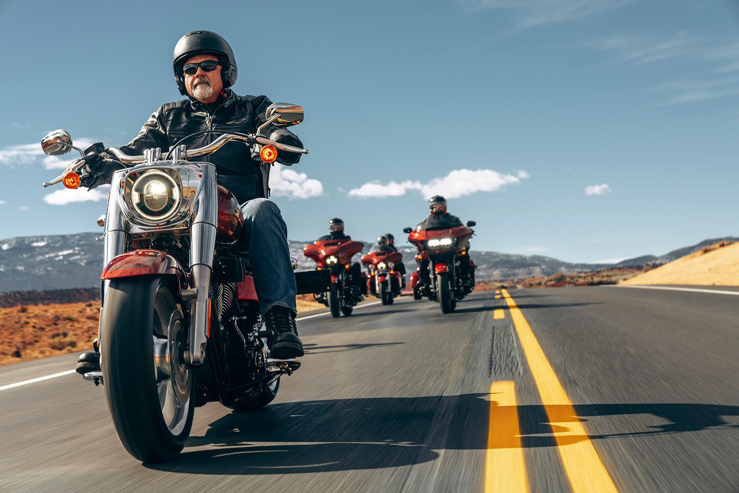 Harley’s 2023 Anniversary lineup on the road; look close, and you'll spot the Street Glide Special’s batwing fairing and LED headlamp to the immediate right of the Anniversary edition Fat Boy in the lead.