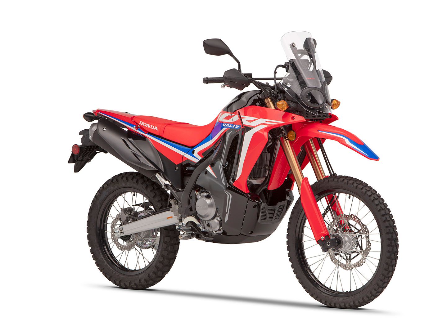With a skid plate, hand guards, and frame-mounted windscreen, the CRF300L Rally is well-equipped to thwart off the elements.