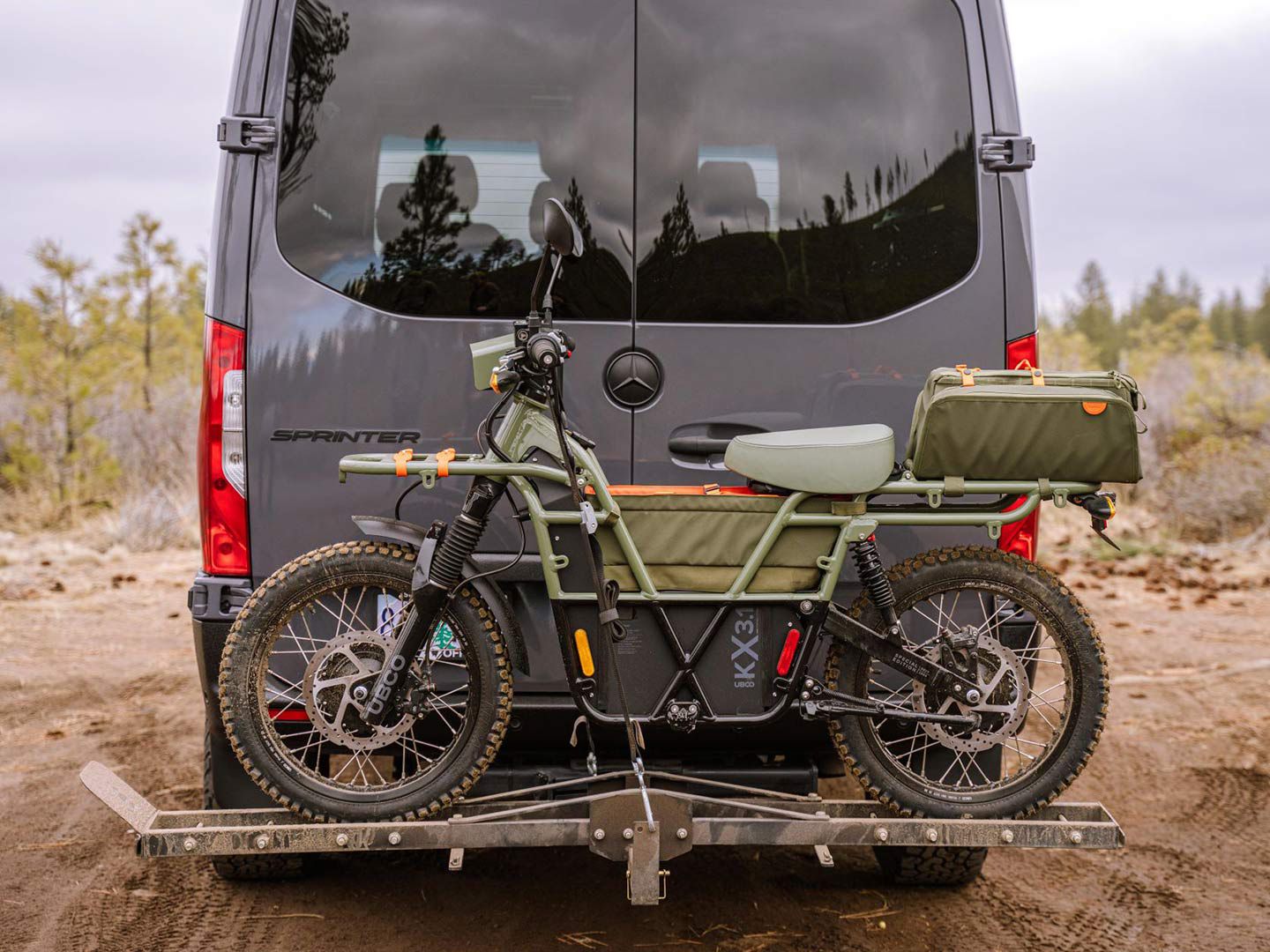Muddy fun in Oregon: The UBCO 2x2 SE hitches a ride with Sprinter friend.