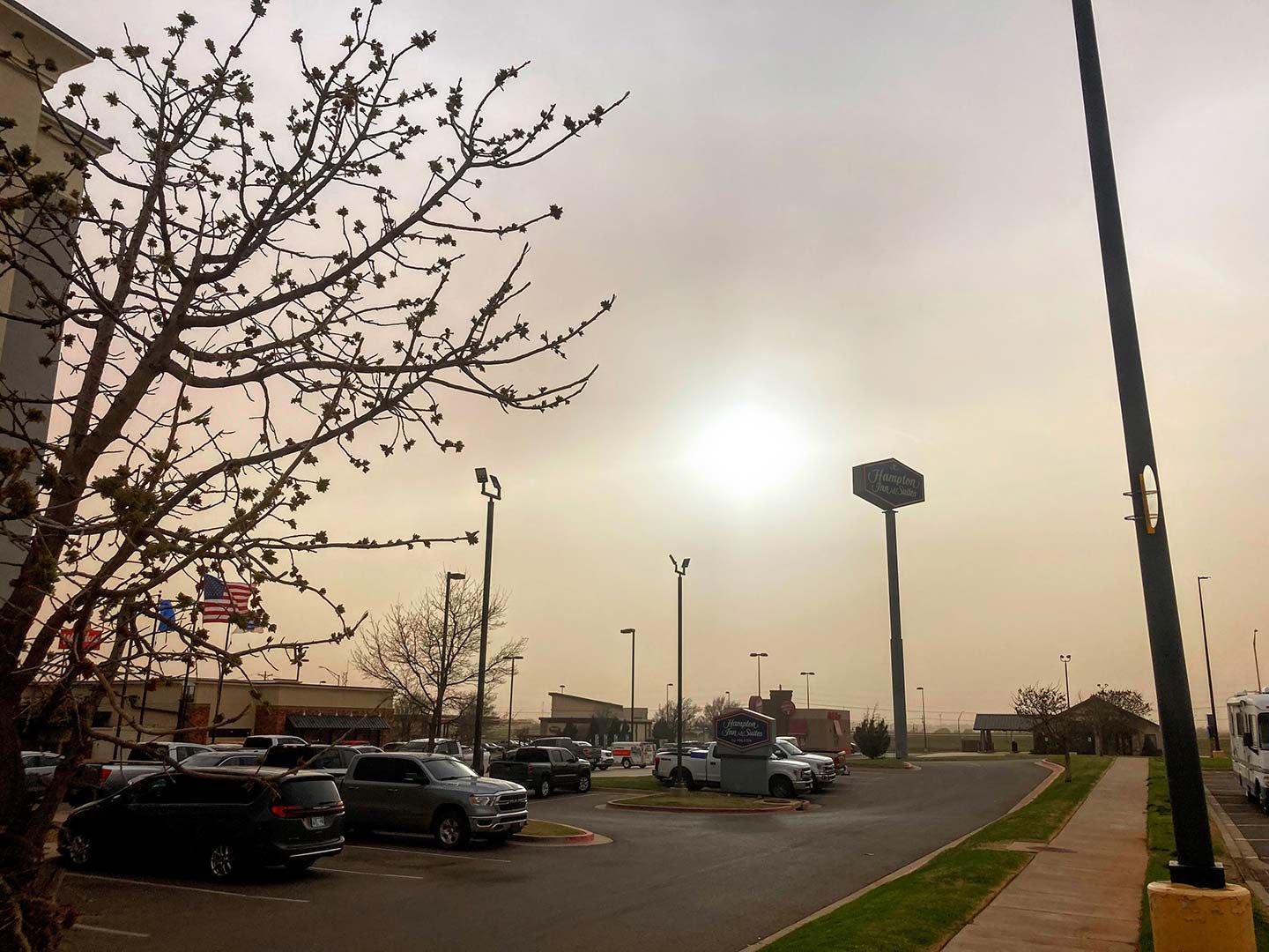 The sun tries in vain to shine through the dust in Elk City, Oklahoma.