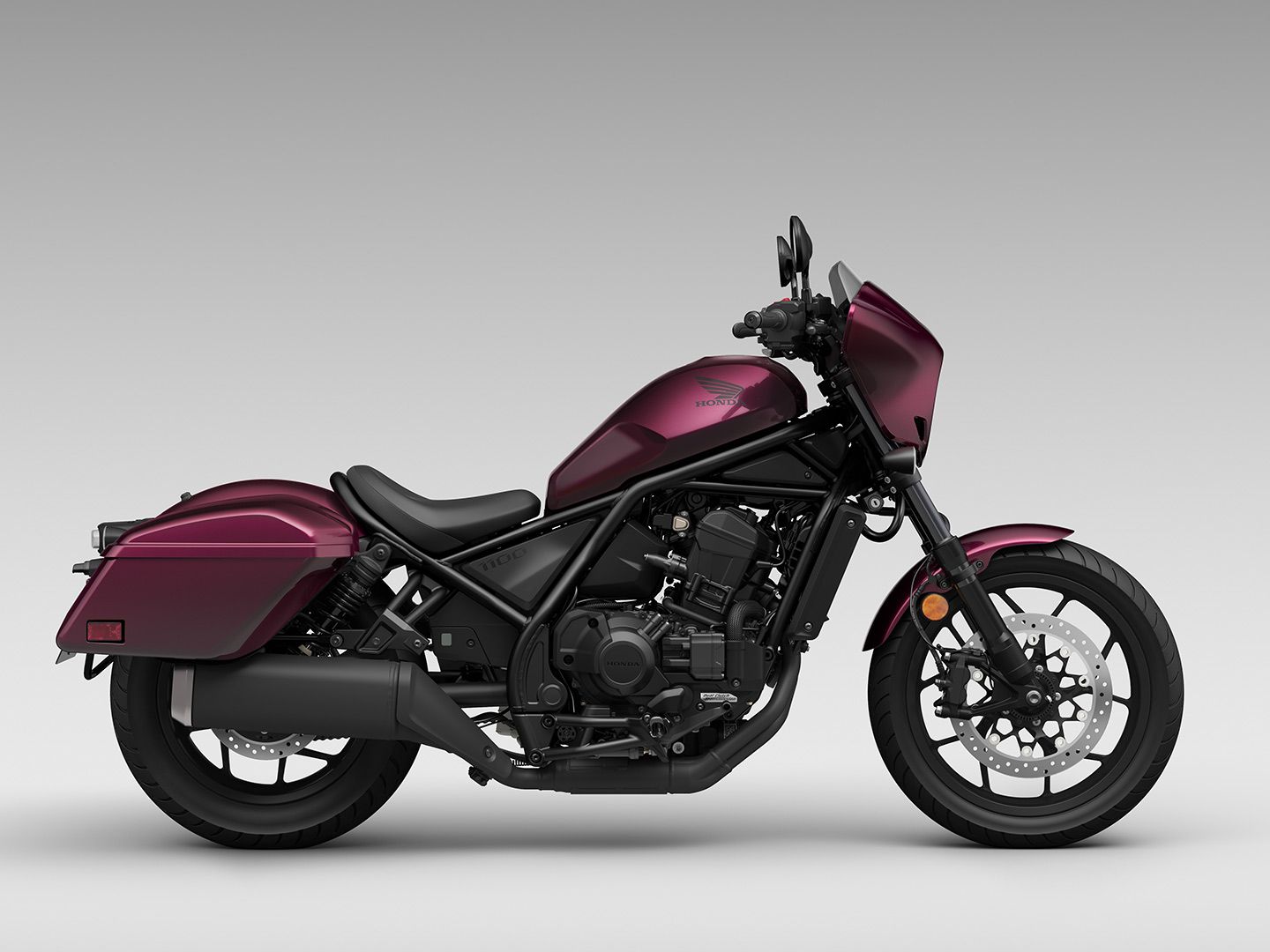 The highest-displacement Rebel is the Rebel 1100. It has two other trims that incorporate a dual-clutch transmission. The bagger-styled Rebel 1100T DCT (shown here) also adds on a sleek batwing fairing, windscreen, and useful hard luggage (total of 35 liters of storage).