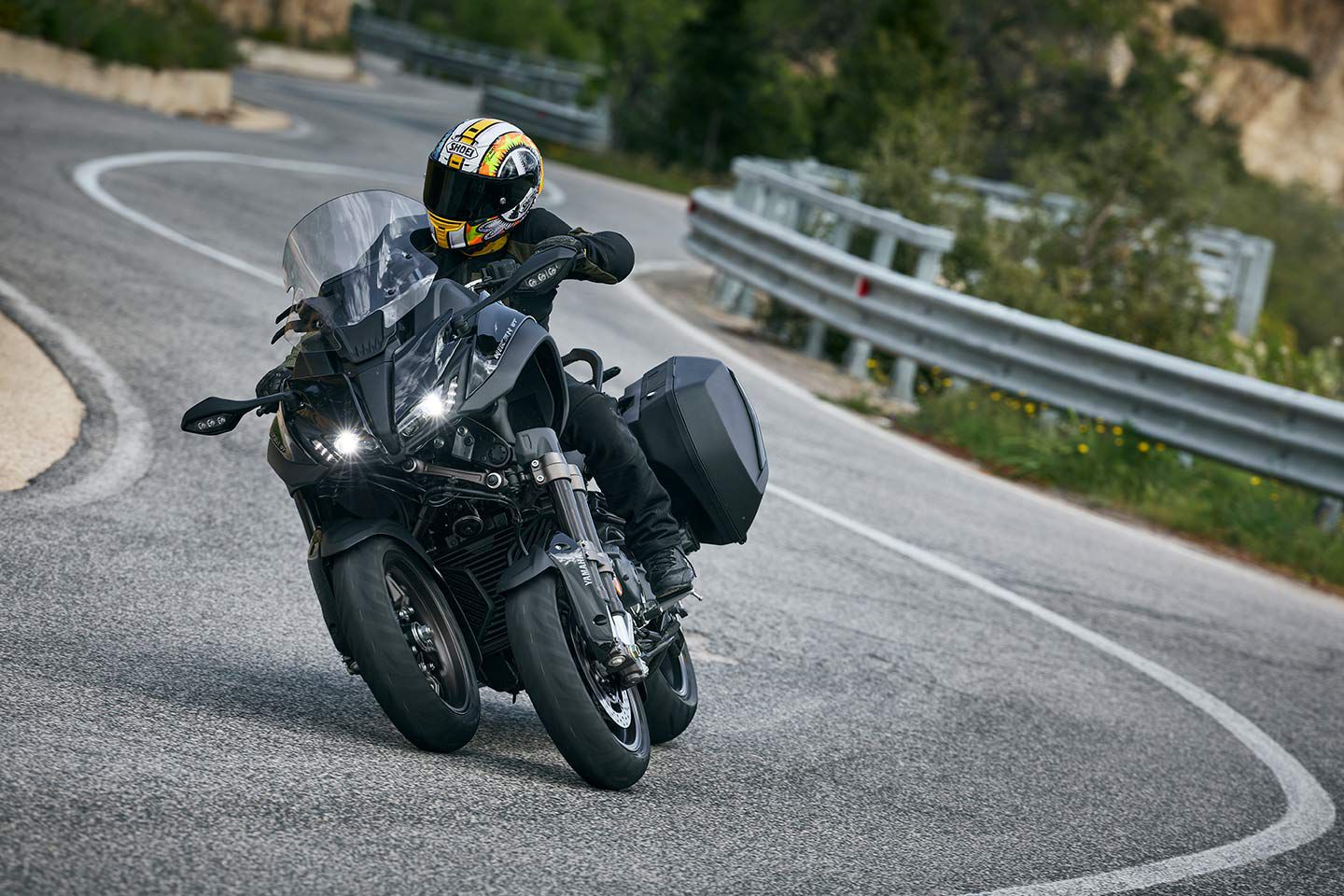 Not keyless. One key operates the ignition and both panniers. The rear carrier can accommodate a top case for more luggage capacity if required.