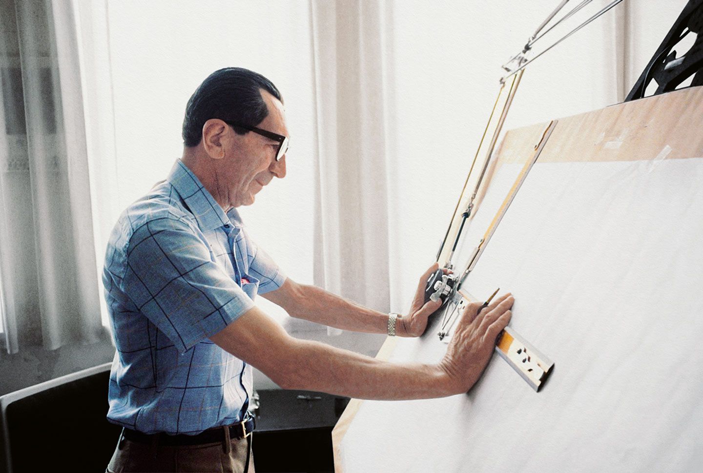 Famed engineer Fabio Taglioni at his drawing board, at work for Ducati, 1974.