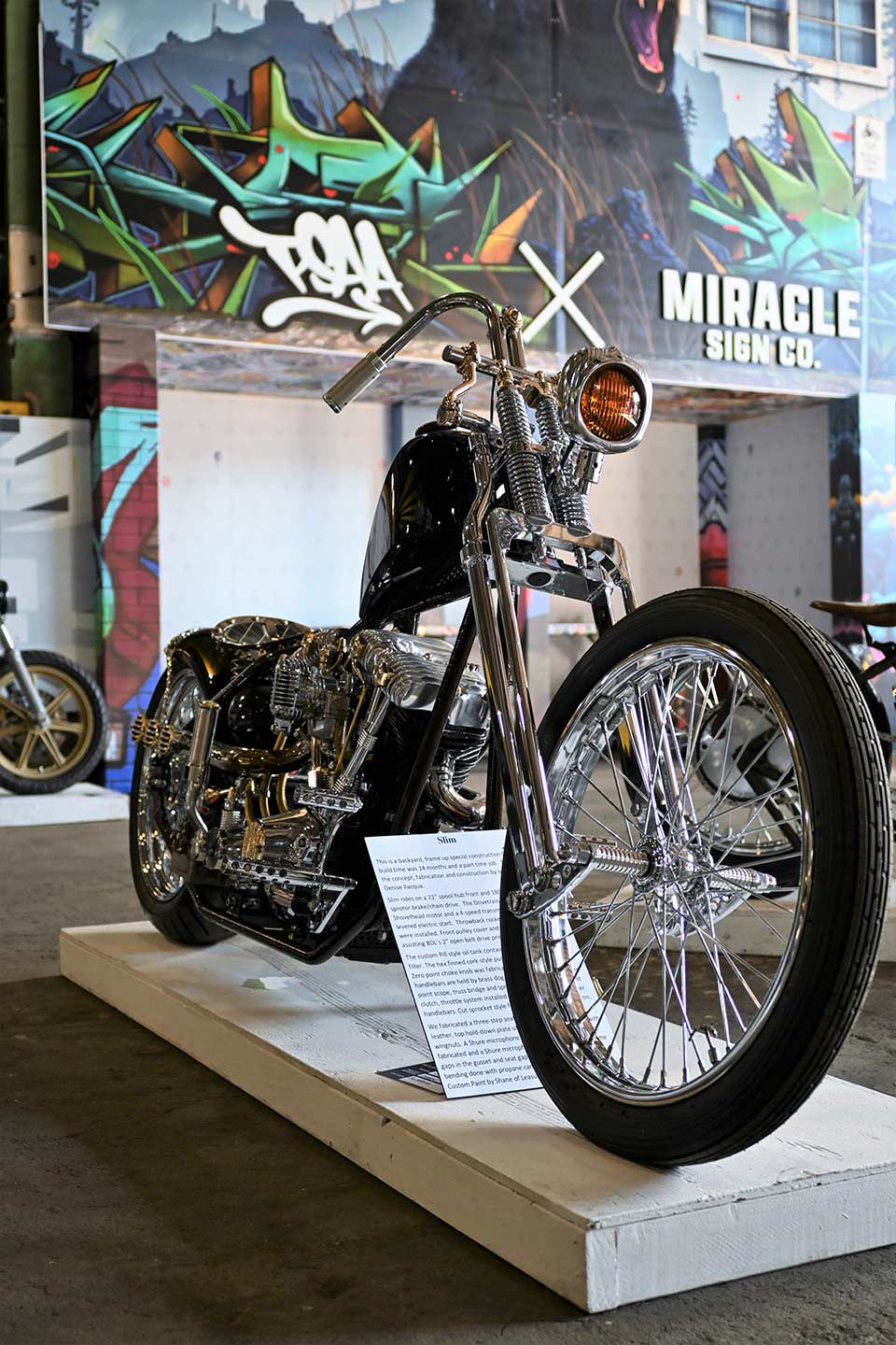 Dubbed “Slim,” this frame-up, special construction chopper features a 1976 Shovelhead engine, custom Pill-style oil tank, and a Shure microphone as an intake! Owners Gino and Denise Ilacqua did much of the concept, fabrication, and assembly.