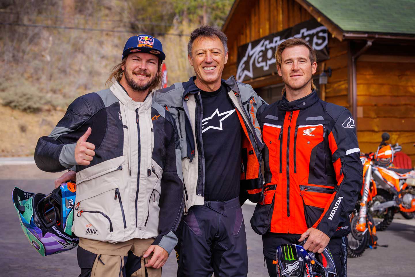 Alpinestars president Gabriele Mazzarolo lives, eats, and breathes motorcycles. Here he takes a photo with two of his top Dakar-winning athletes, Toby Price (left) and Ricky Brabec (right).