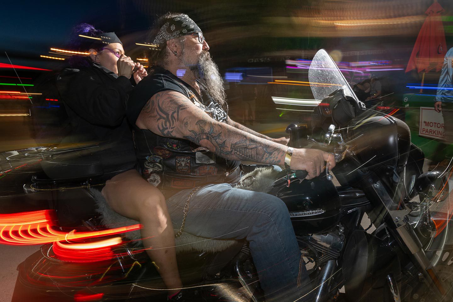 Next stop, night fun. Riding Main Street at dusk during the Sturgis Motorcycle Rally.
