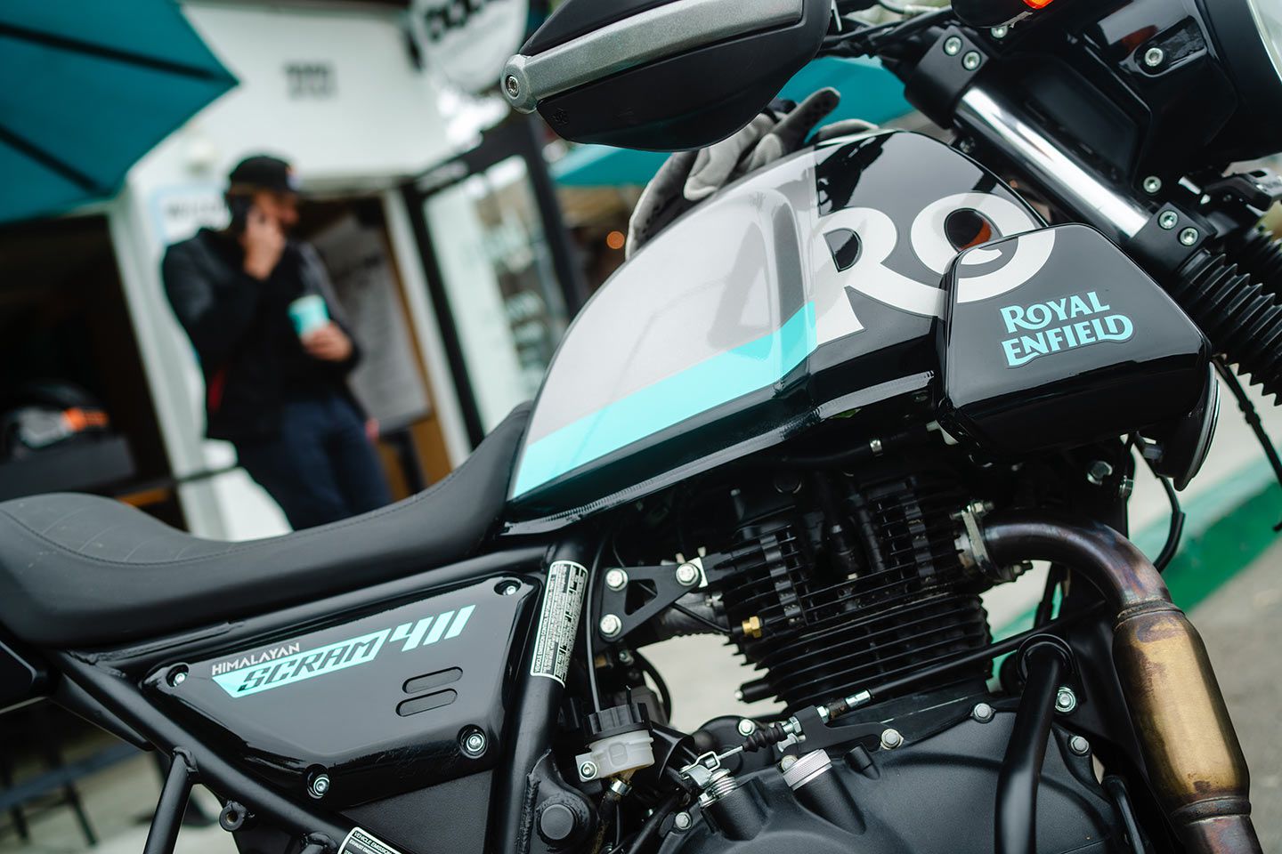 The Scram is powered by an air-cooled 411cc fuel-injected single. Fins around the cylinder and cylinder head keep the engine cool.